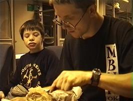 Julian cuts the bread for our impromptu lunch on the train